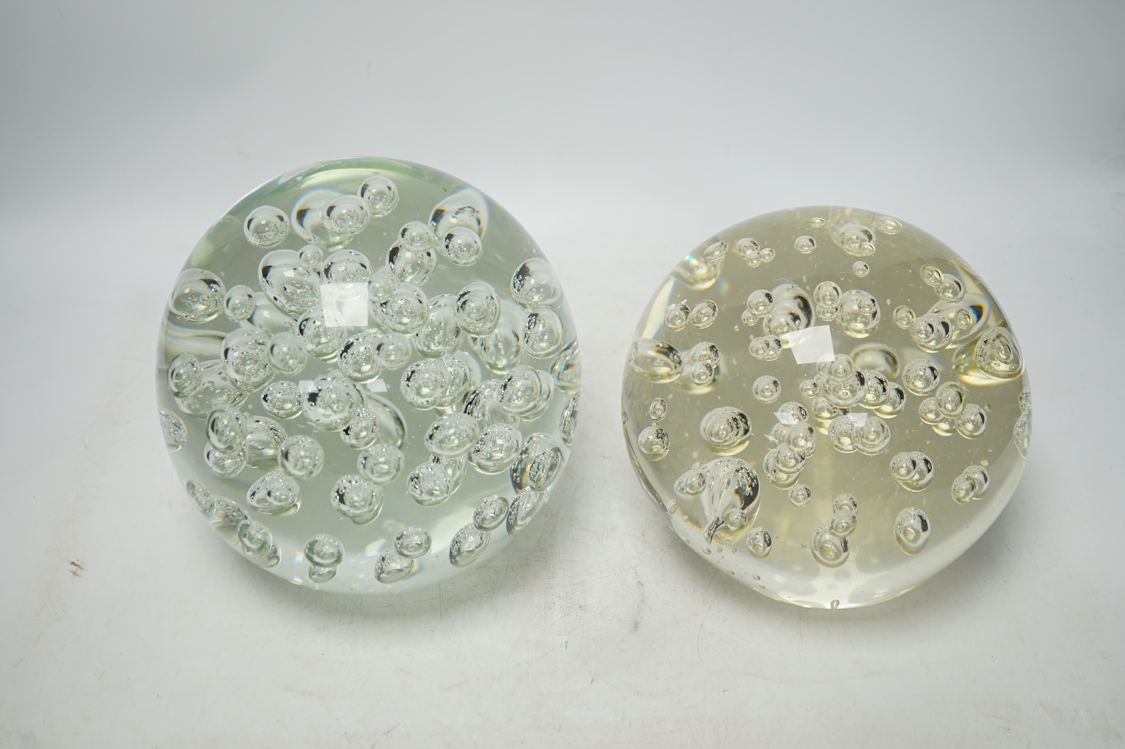 Two large glass bubble included door stops, 18cm. Condition - fair